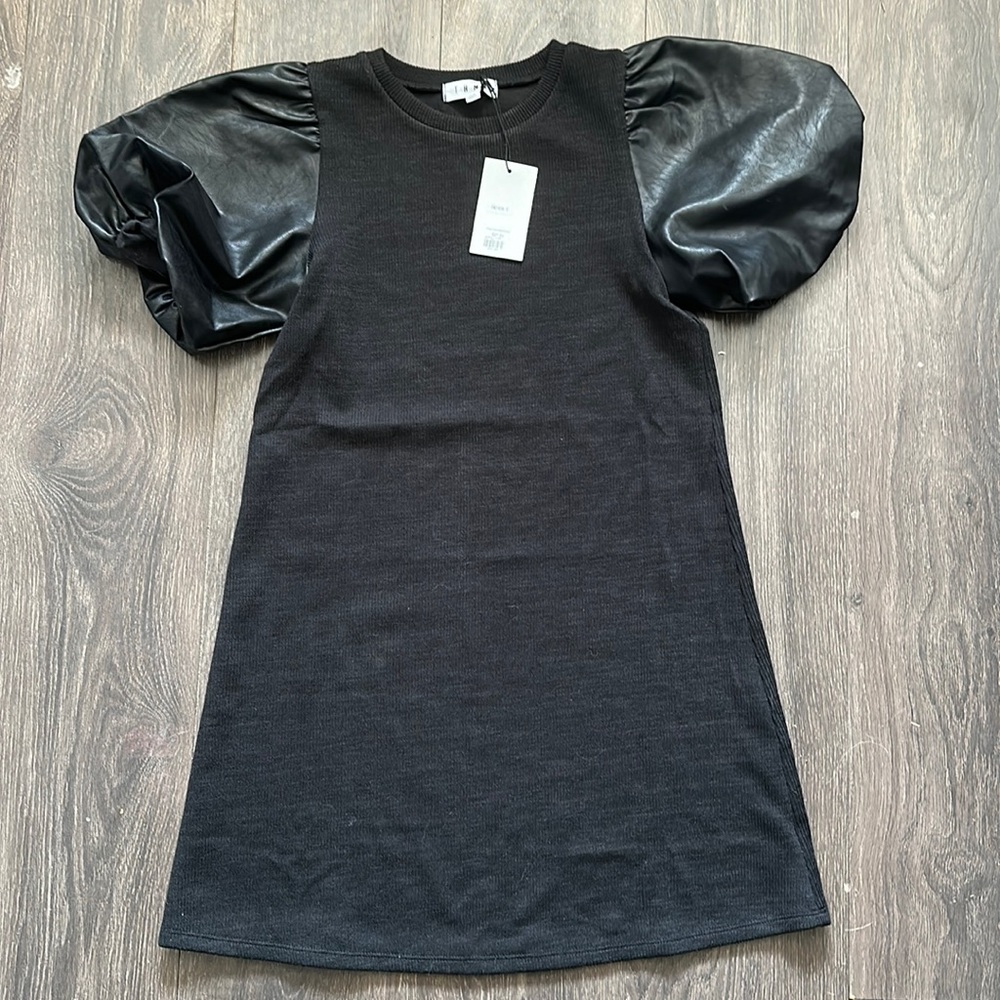 Black tshirt dress with pleather sleeves.
